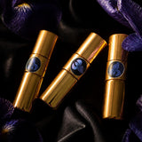 Zestaw próbek perfum Blueirys, trzy złote fiolki 2 ml wśród irysów